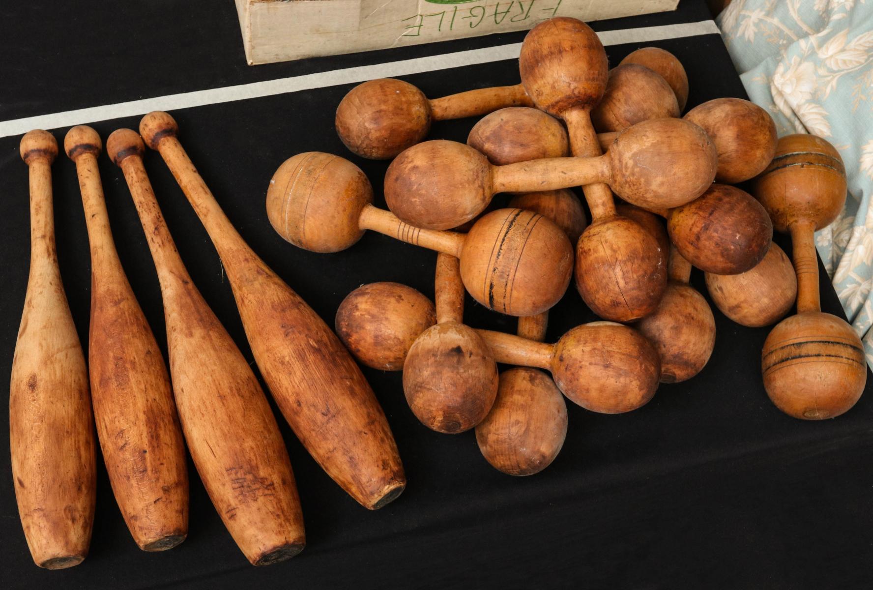 EARLY 20TH CENTURY INDIAN CLUBS AND DUMBBELLS