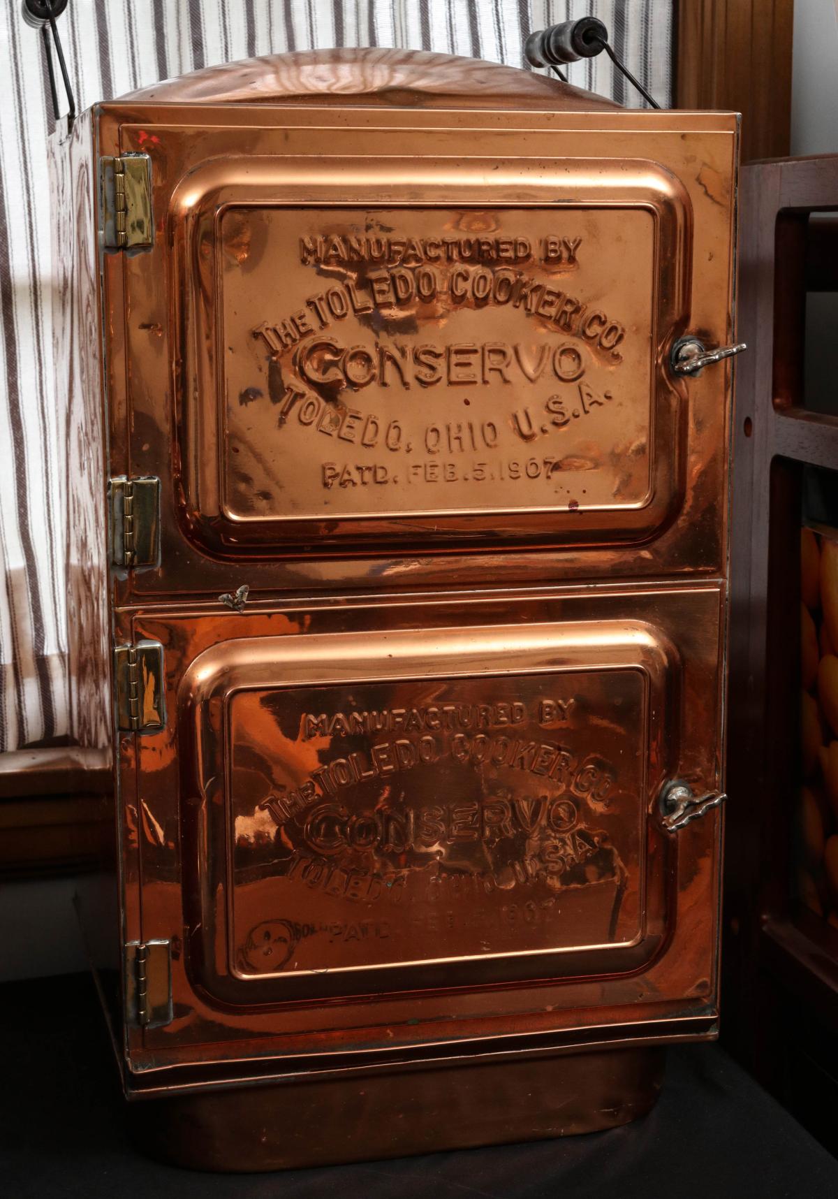 A COPPER COOKER DATED 1907