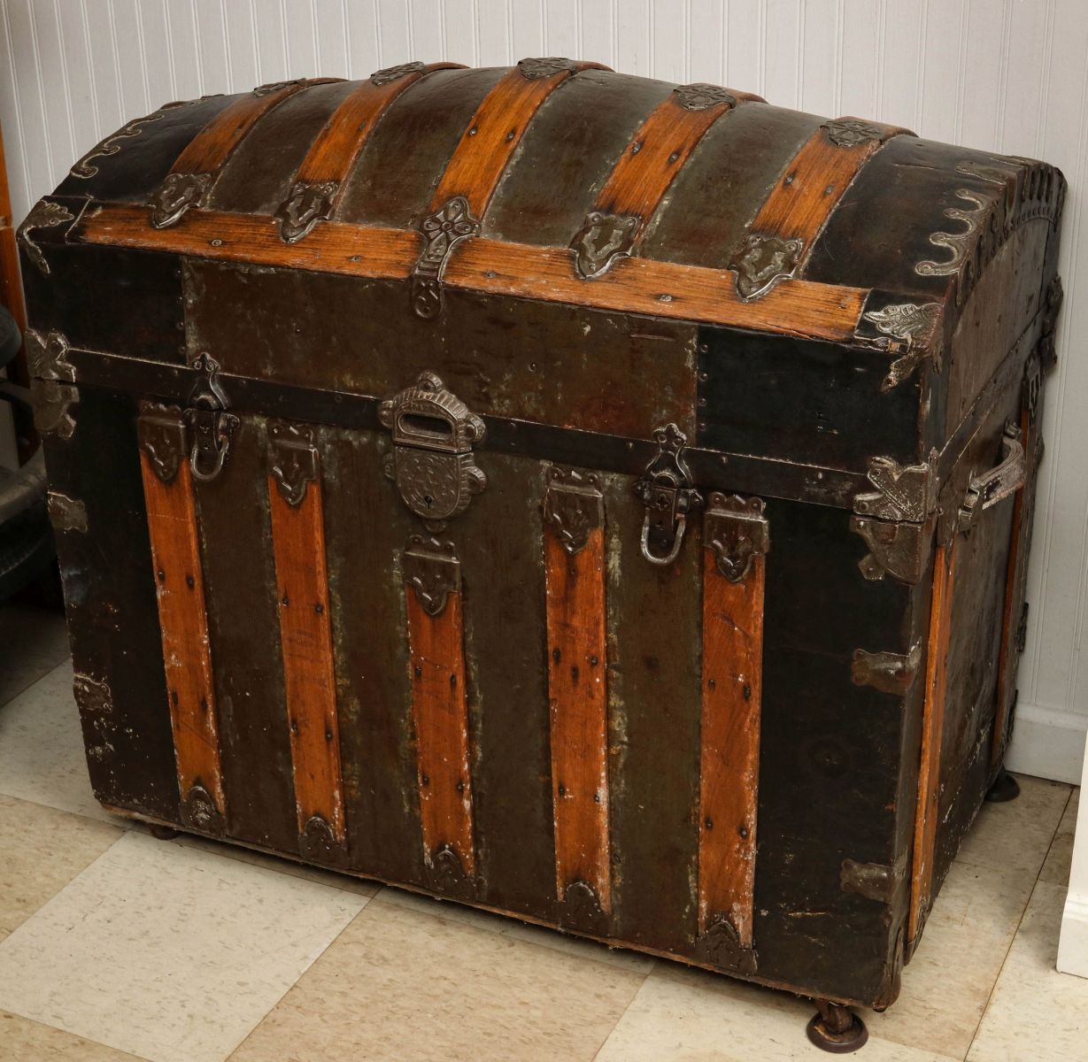 AN UNUSUALLY TALL VICTORIAN HUMPBACK TRAVEL TRUNK