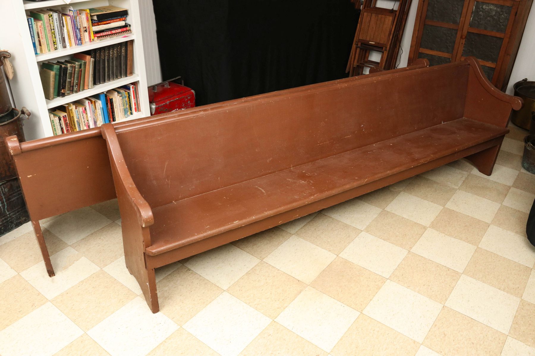 TWO PRIMITIVE CHURCH PEWS IN OLD BROWN PAINT