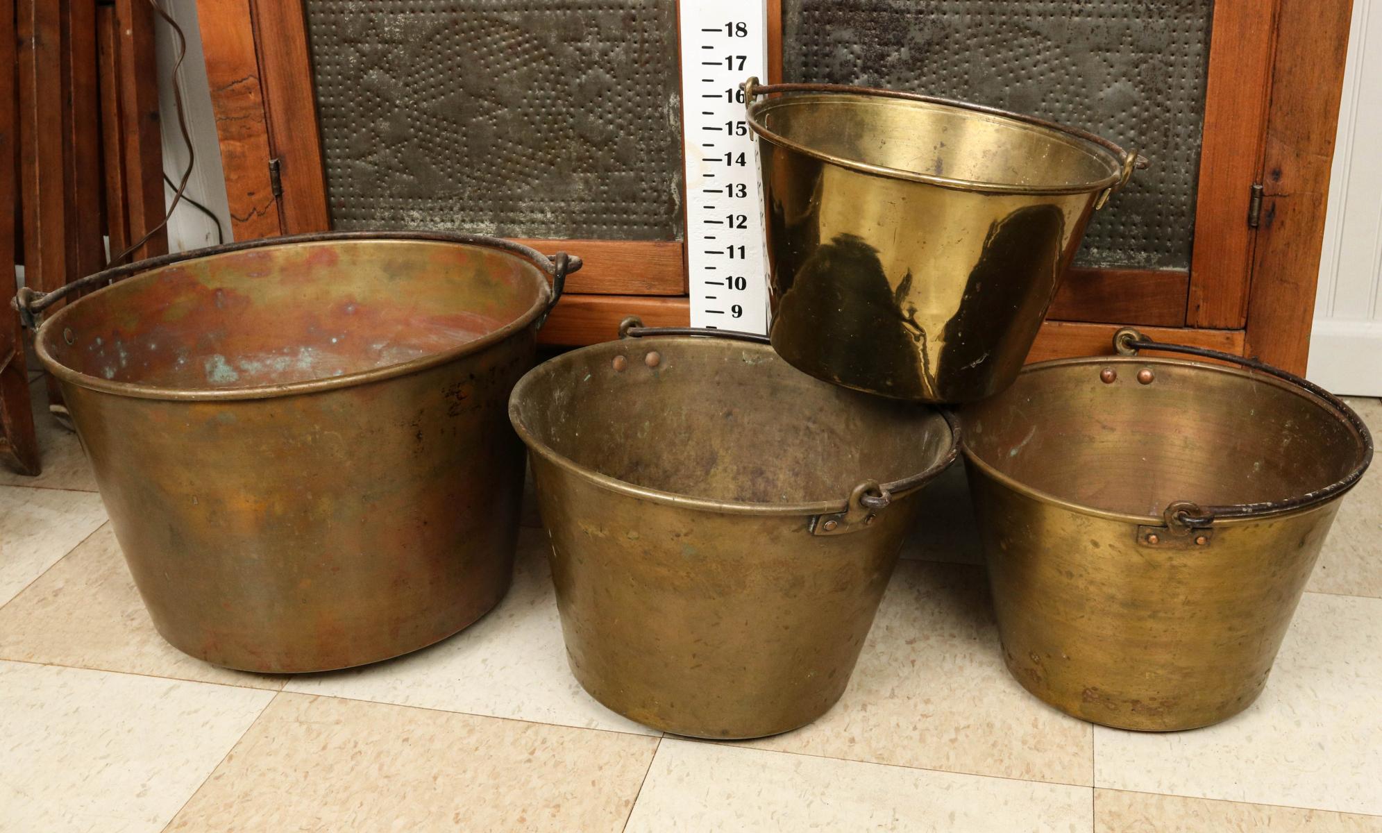 FOUR 19TH CENTURY SPUN BRASS KETTLES