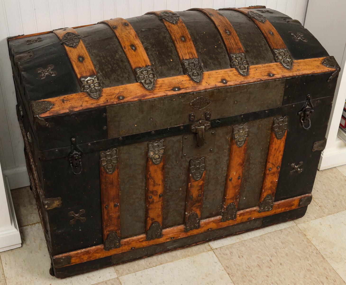 A VICTORIAN WOOD SLAT 'HUMP BACK' TRAVEL TRUNK