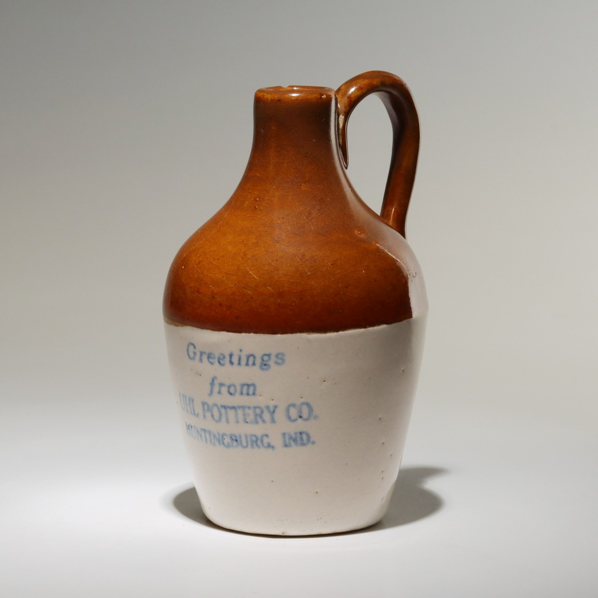 AN UNDATED UHL POTTERY GREETINGS STONEWARE MINI JUG