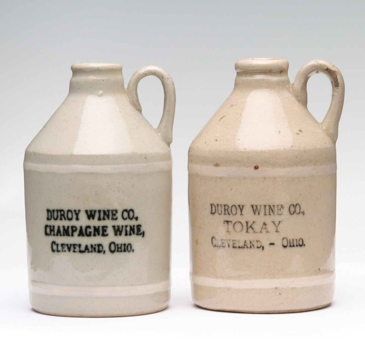 TWO CLEVELAND OHIO STONEWARE MINI JUGS