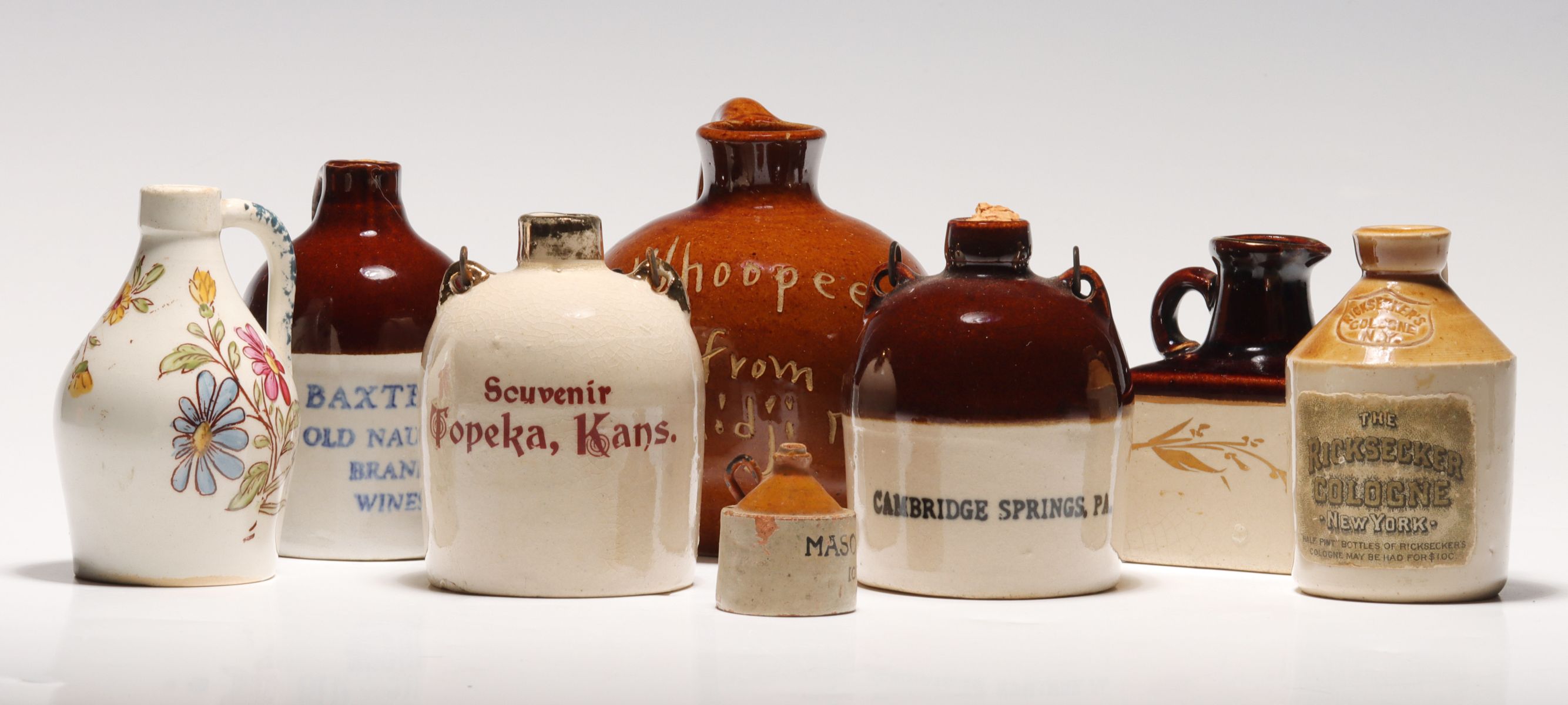 A COLLECTION OF SOUVENIR STONEWARE MINI JUGS