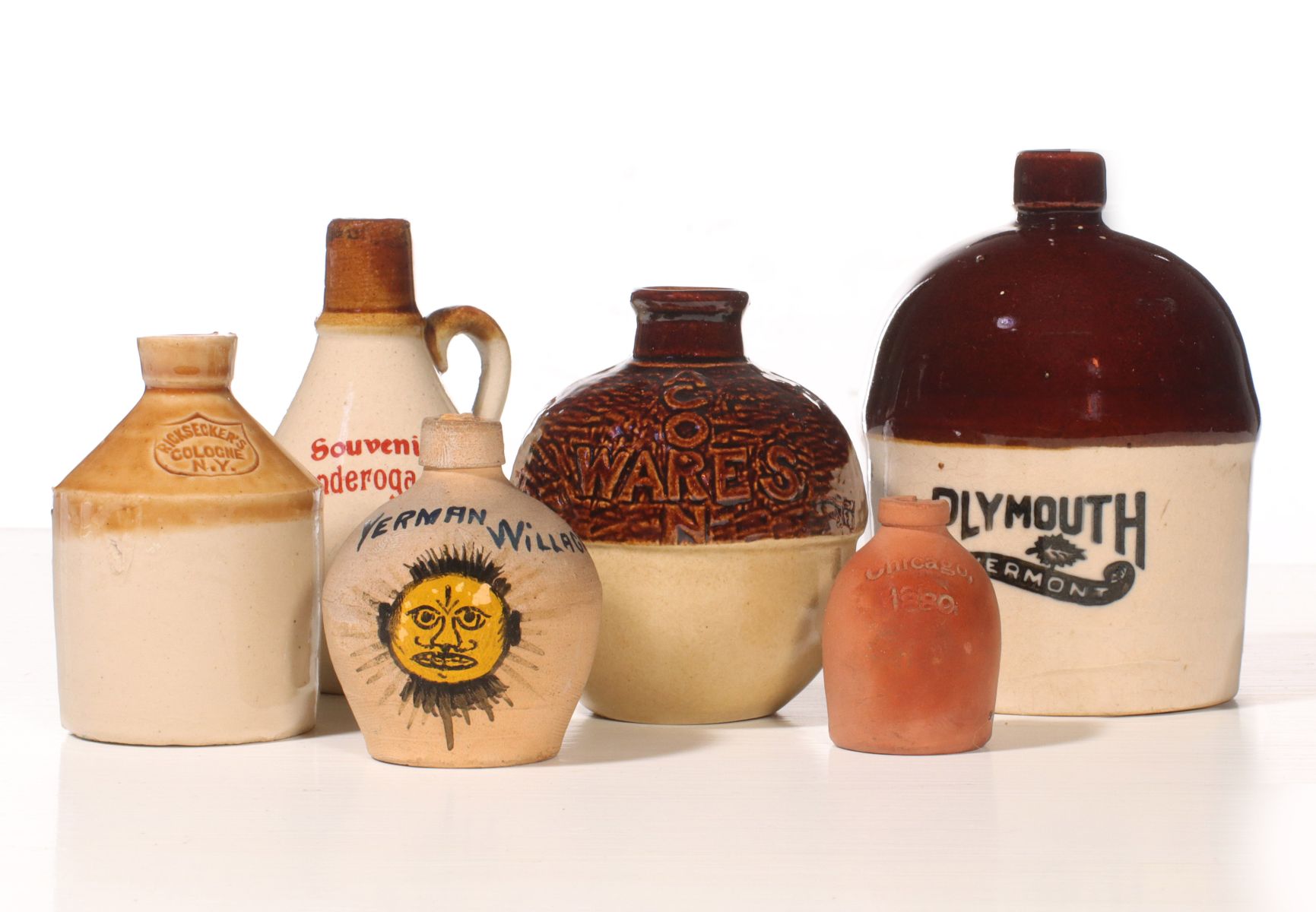 A COLLECTION OF SOUVENIR STONEWARE MINI JUGS