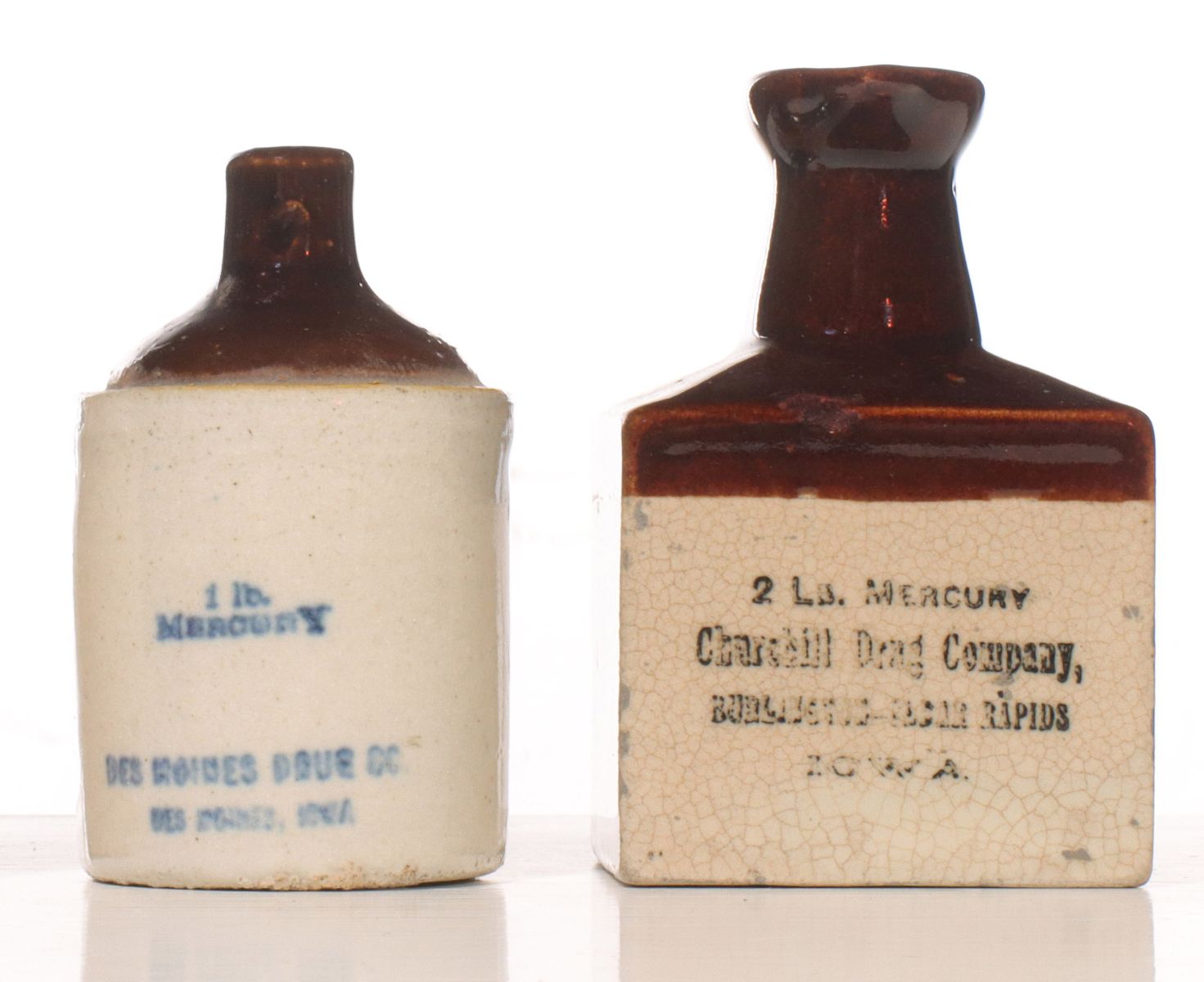 TWO IOWA MERCURY TWO-SIDED DRUG COMPANY MINI JUGS