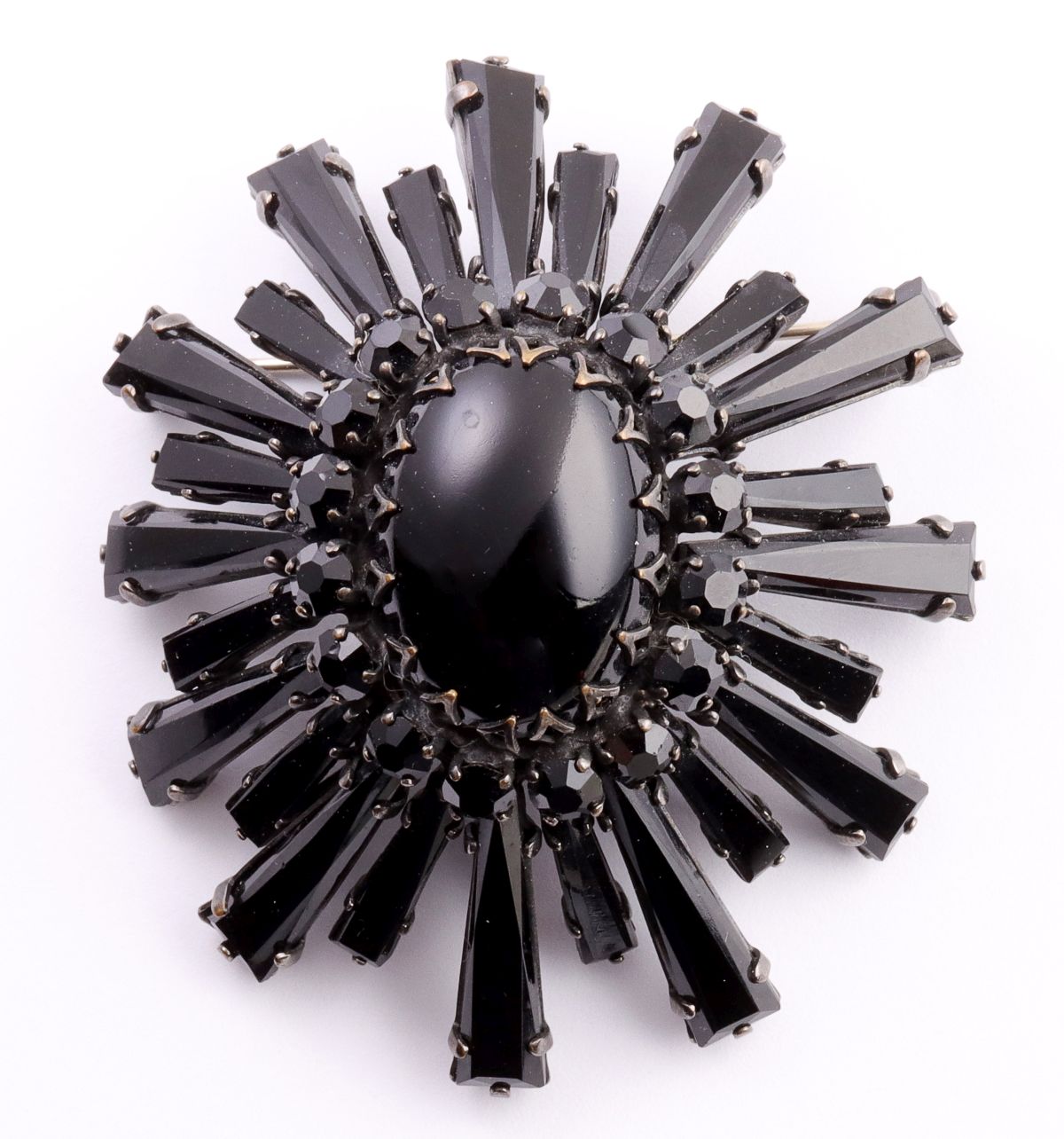 A BLACK-ON-BLACK RUFFLE BROOCH SIGNED SCHREINER