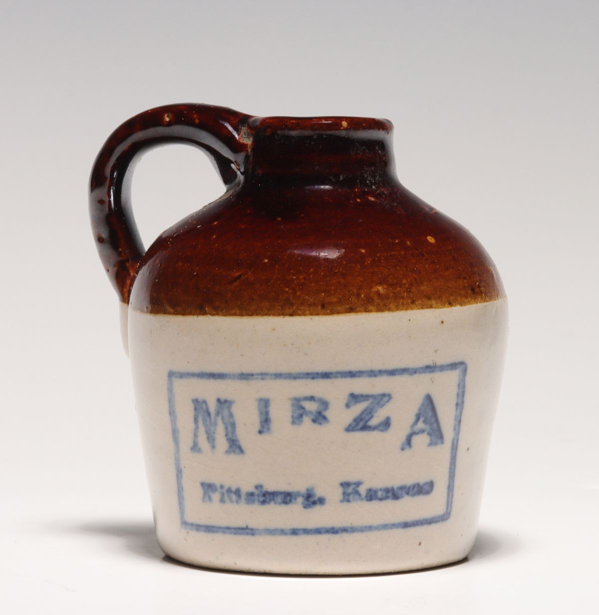 A MIRZA PITTSBURG KANSAS STONEWARE MINI JUG