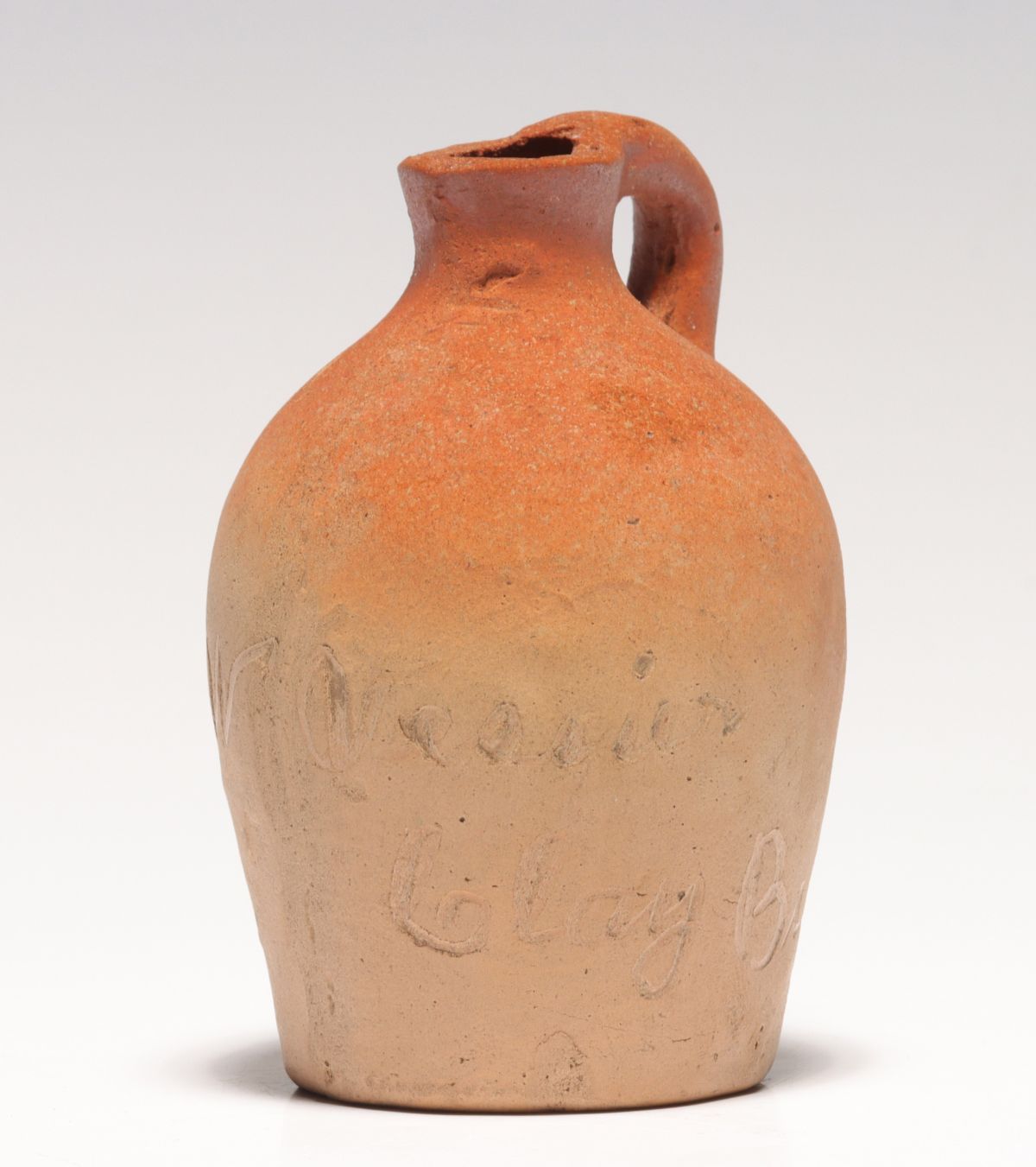 A SCRATCHED STONEWARE MINI JUG