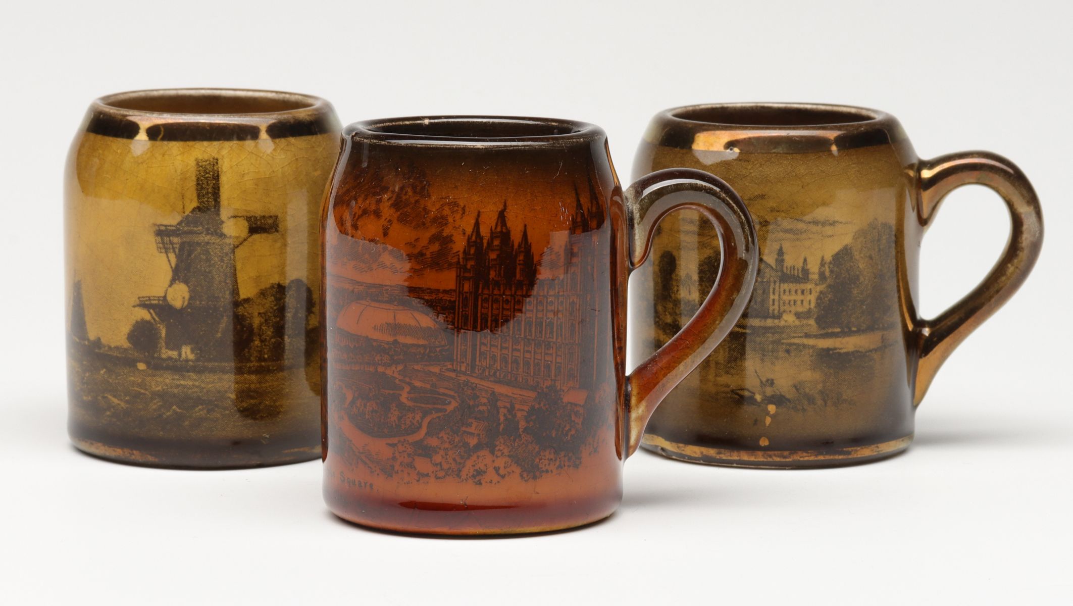 THREE ANTIQUE STRIKER MUGS