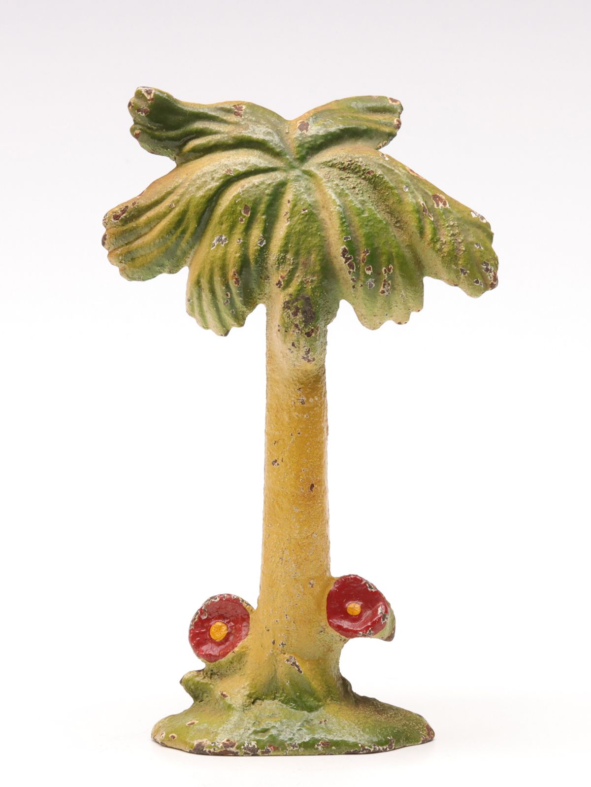 A VINTAGE ISLAND PALM TREE FIGURAL IRON BOTTLE OPENER