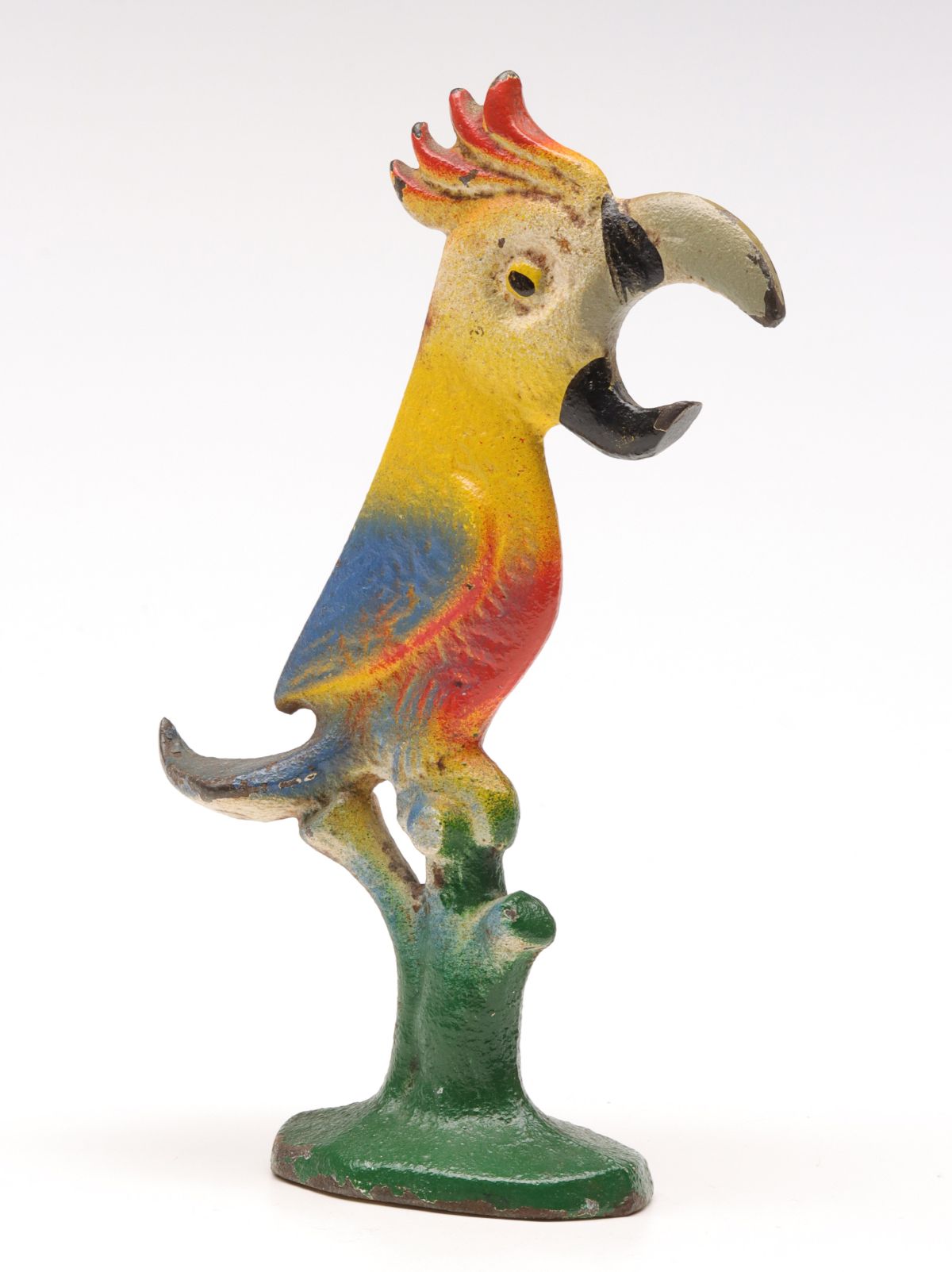 A VINTAGE FIGURAL PARROT IRON BOTTLE OPENER