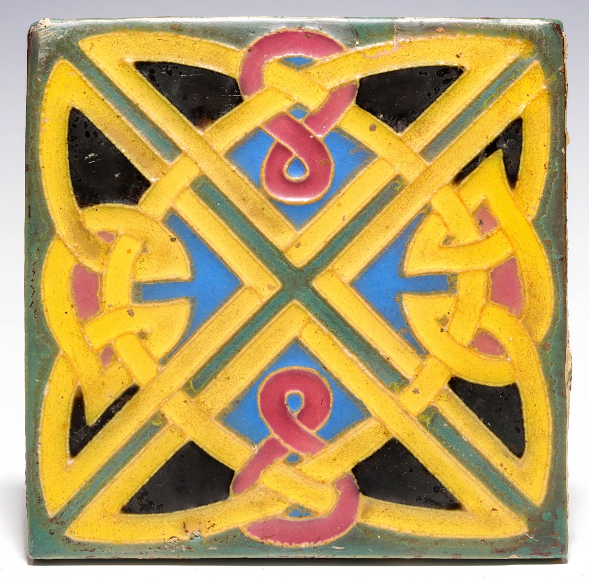 AN ART POTTERY TILE ATTRIBUTED TO WHEATLEY POTTERY