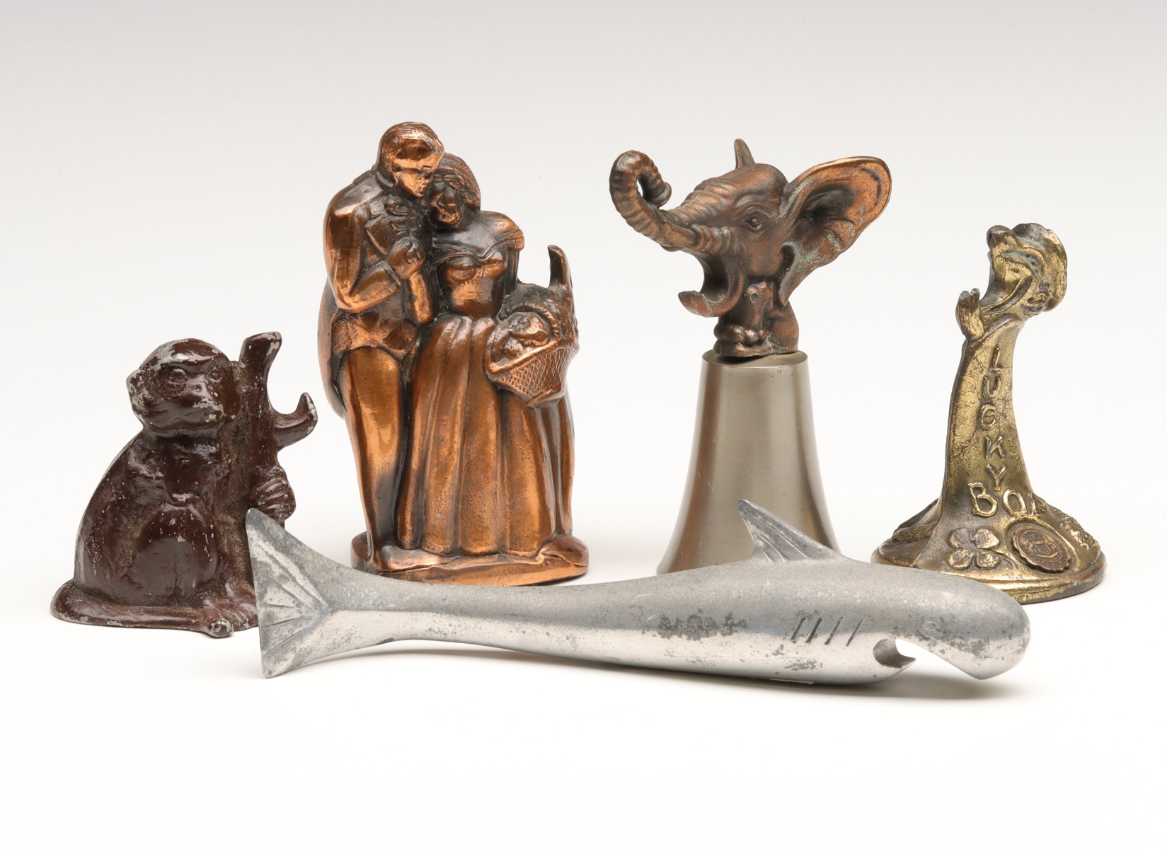 FIVE VINTAGE COLLECTIBLE FIGURAL BOTTLE OPENERS