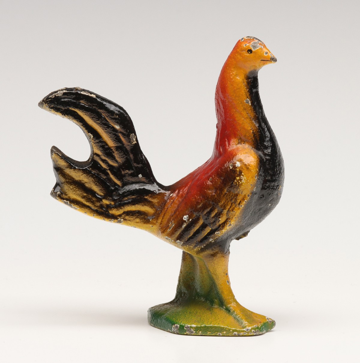 A VINTAGE FIGURAL ROOSTER IRON BOTTLE OPENER