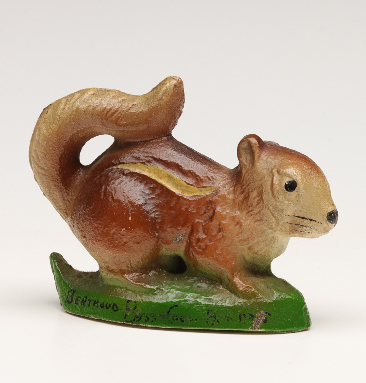 A VINTAGE FIGURAL SQUIRREL IRON BOTTLE OPENER