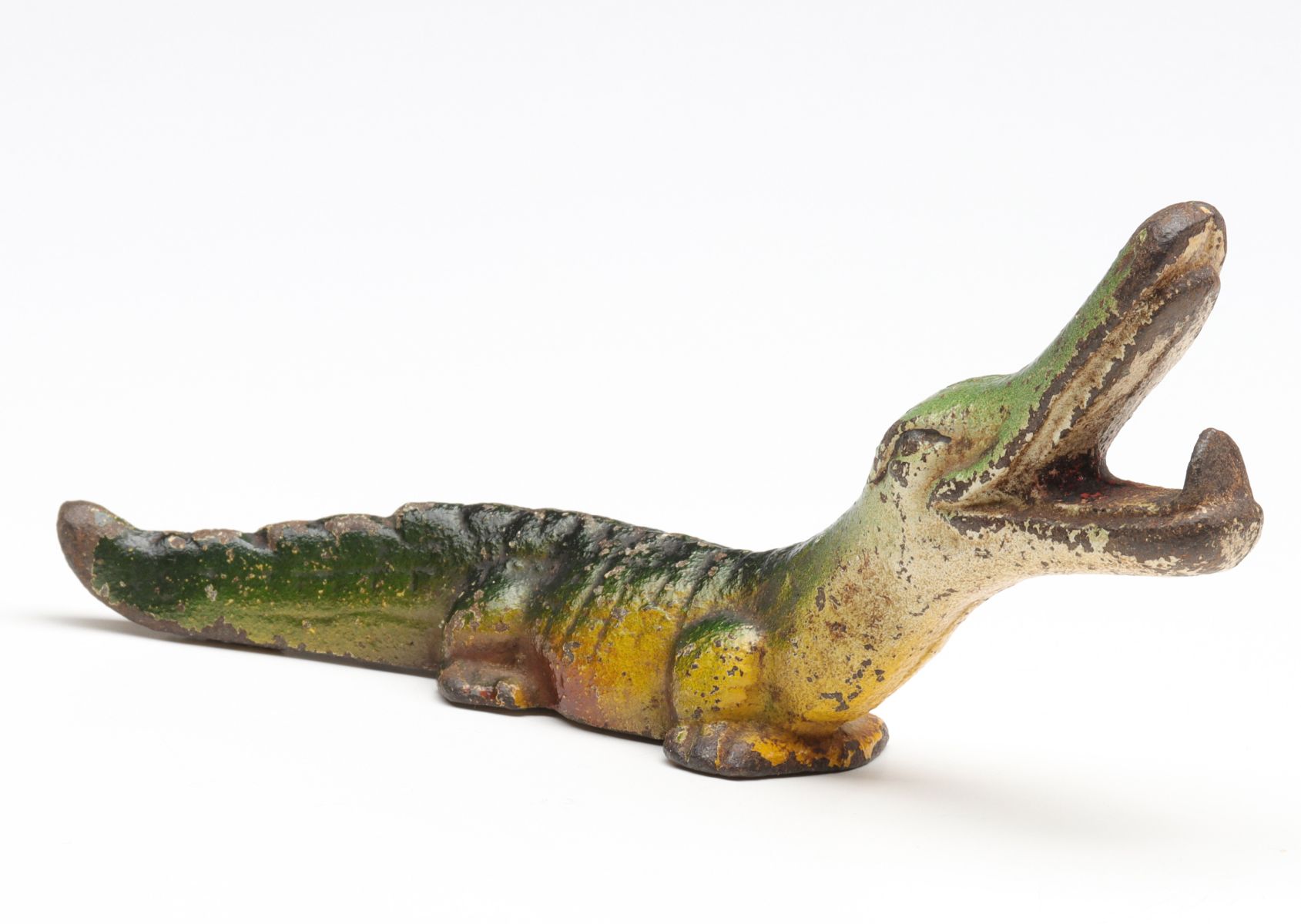 A VINTAGE FIGURAL ALLIGATOR IRON BOTTLE OPENER