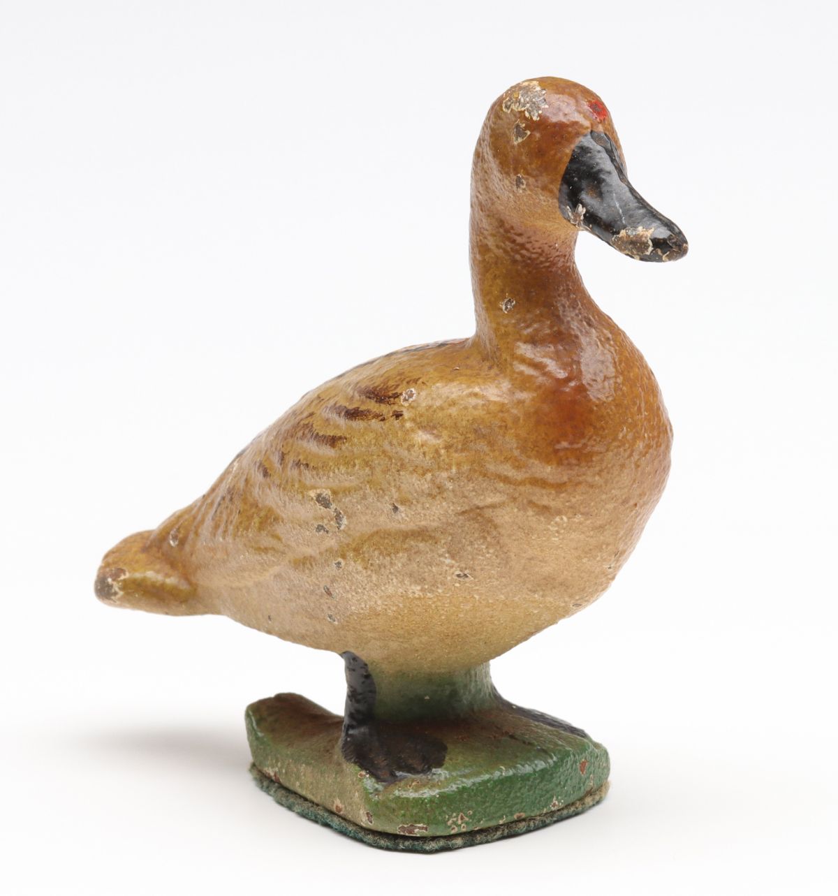 A VINTAGE FIGURAL GOOSE CAST IRON BOTTLE OPENER