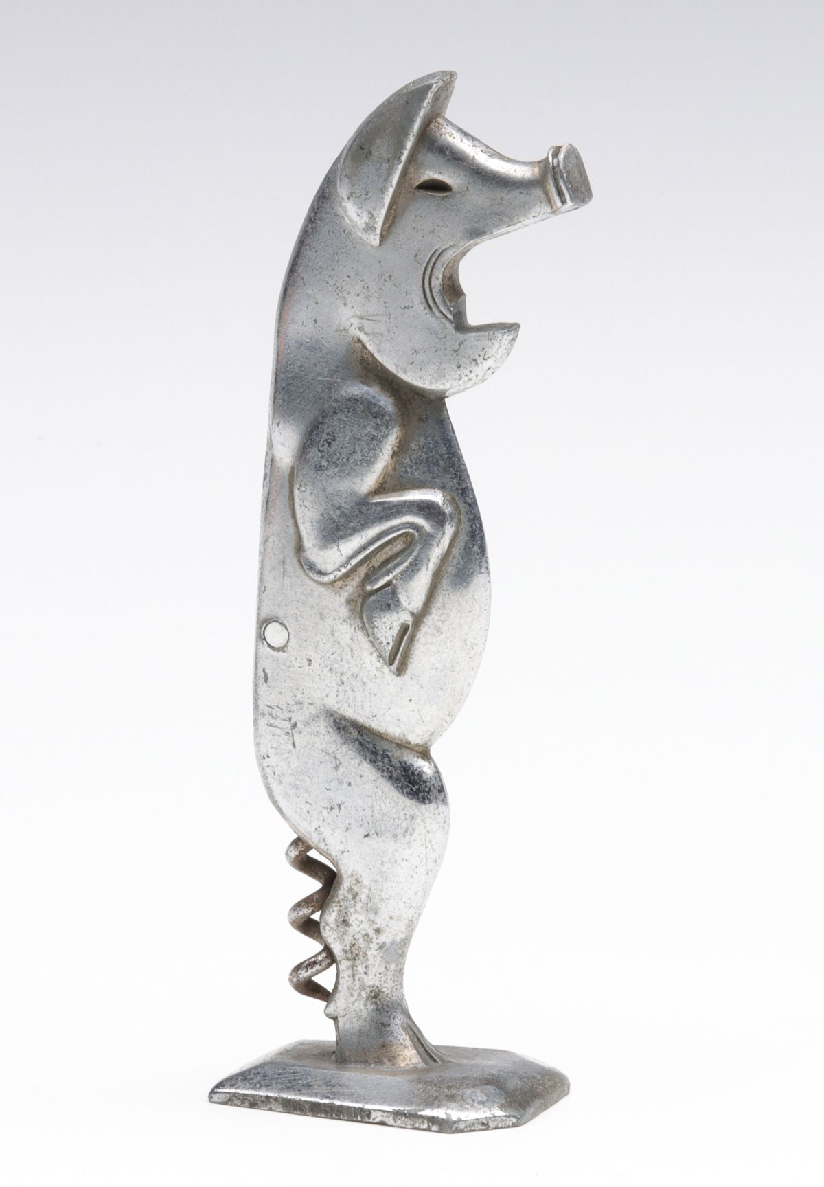 A FIGURAL ART DECO PIG CORKSCREW BOTTLE OPENER