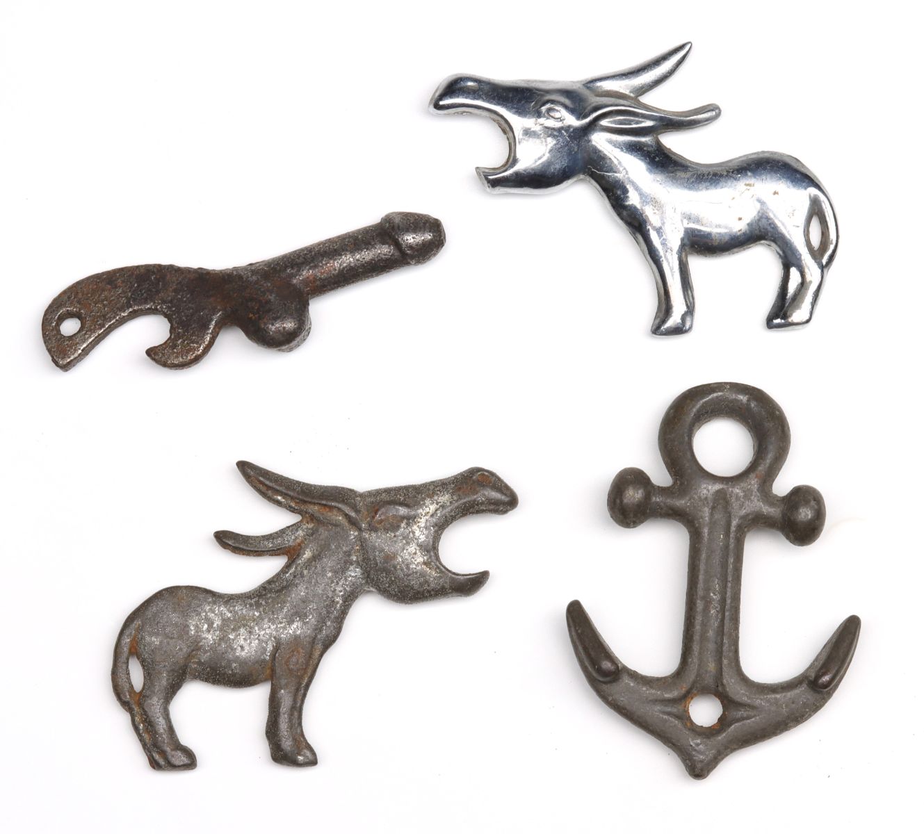 FOUR UNUSUAL ANTIQUE IRON POCKET BOTTLE OPENERS