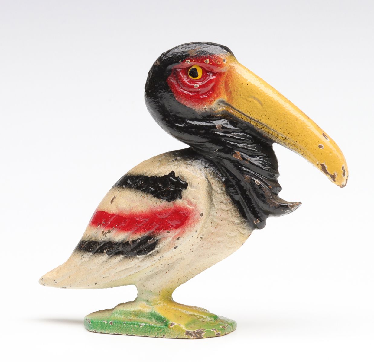 A VINTAGE FIGURAL PELICAN IRON BOTTLE OPENER