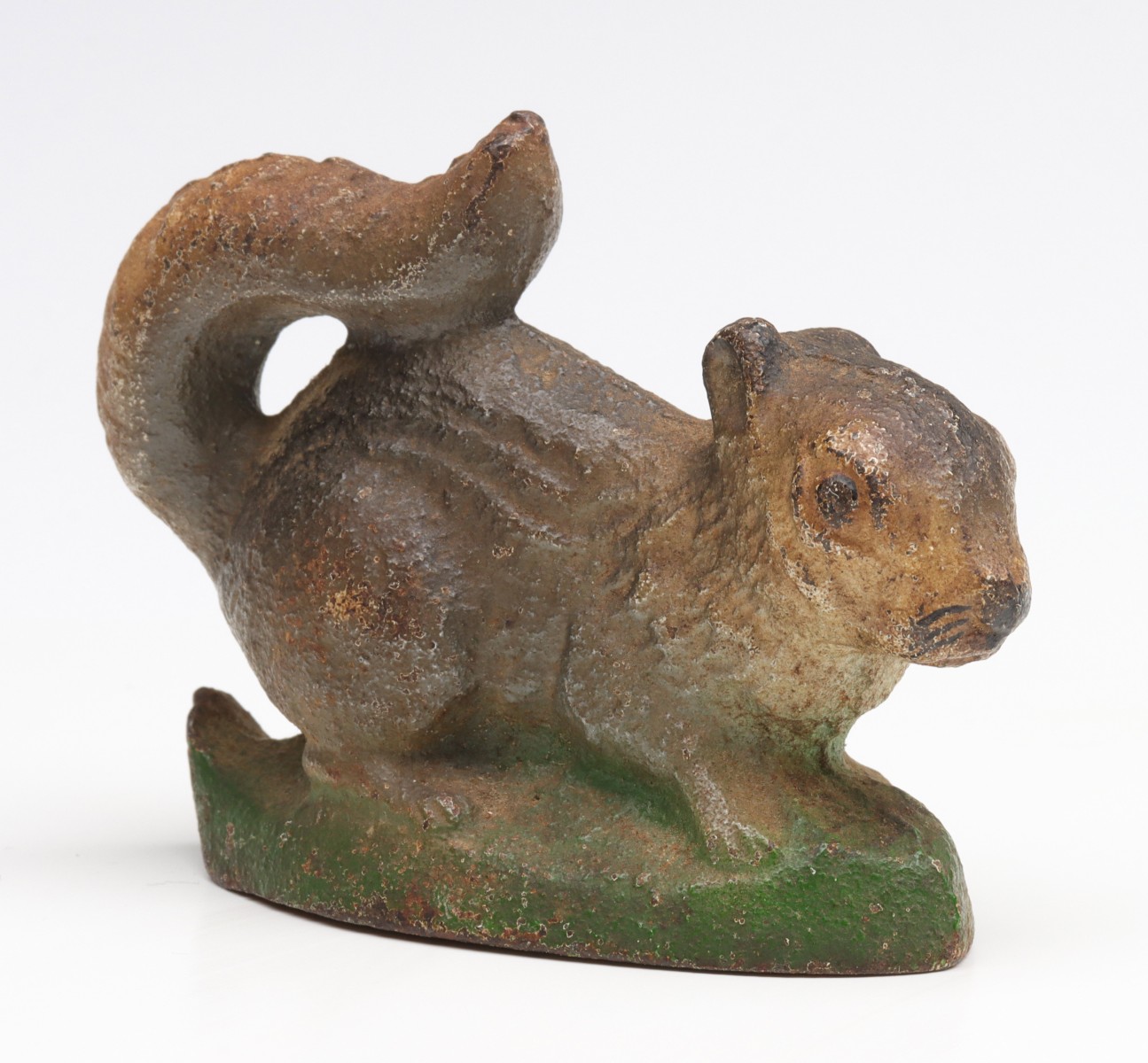 A VINTAGE FIGURAL SQUIRREL IRON BOTTLE OPENER