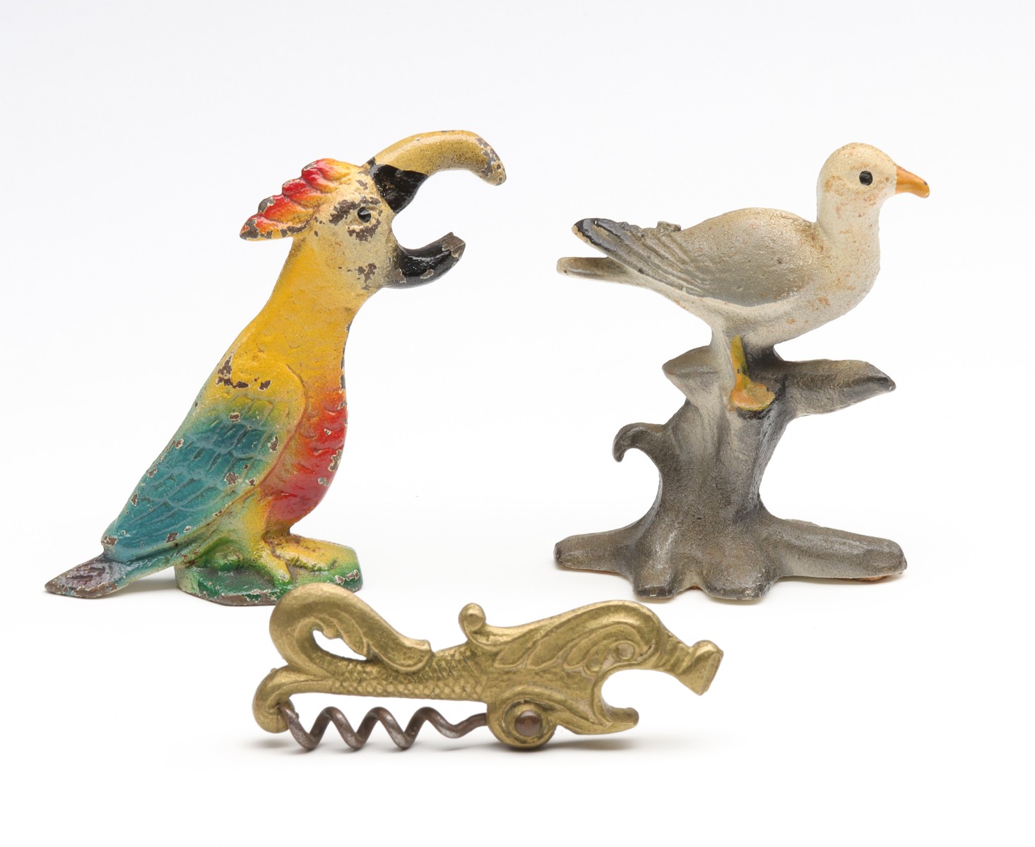 SEAGULL AND PARROT VINTAGE FIGURAL IRON BOTTLE OPENER