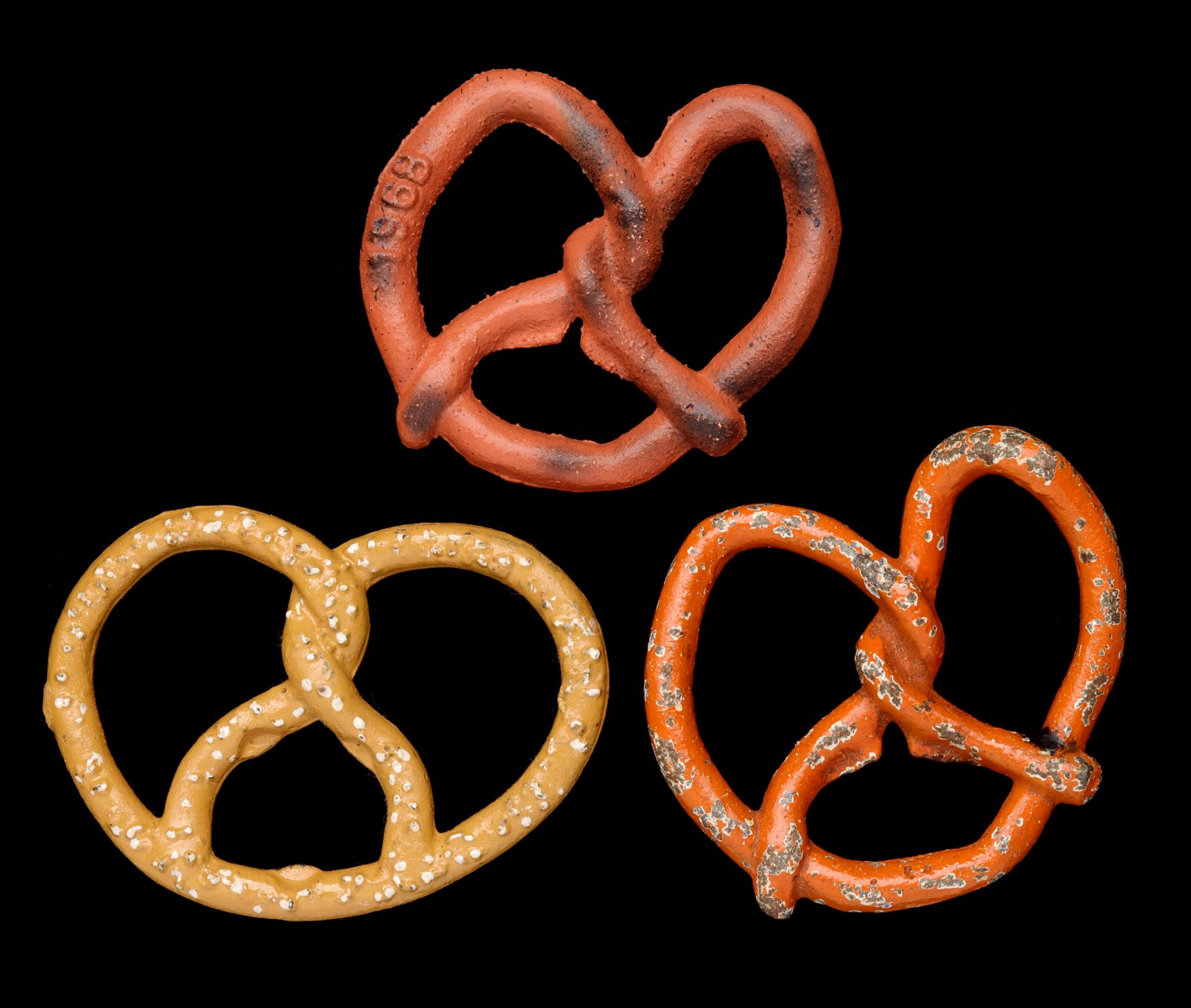 PRETZEL FORM VINTAGE FIGURAL IRON BOTTLE OPENERS