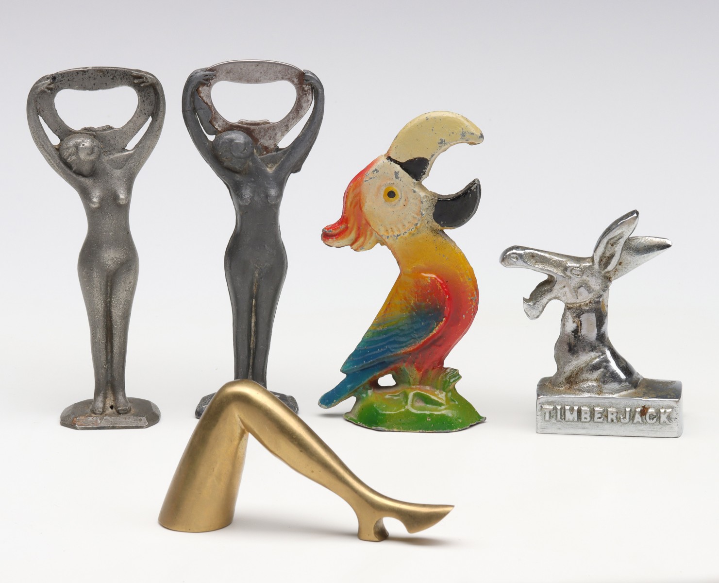 FIVE VINTAGE FIGURAL BOTTLE OPENERS