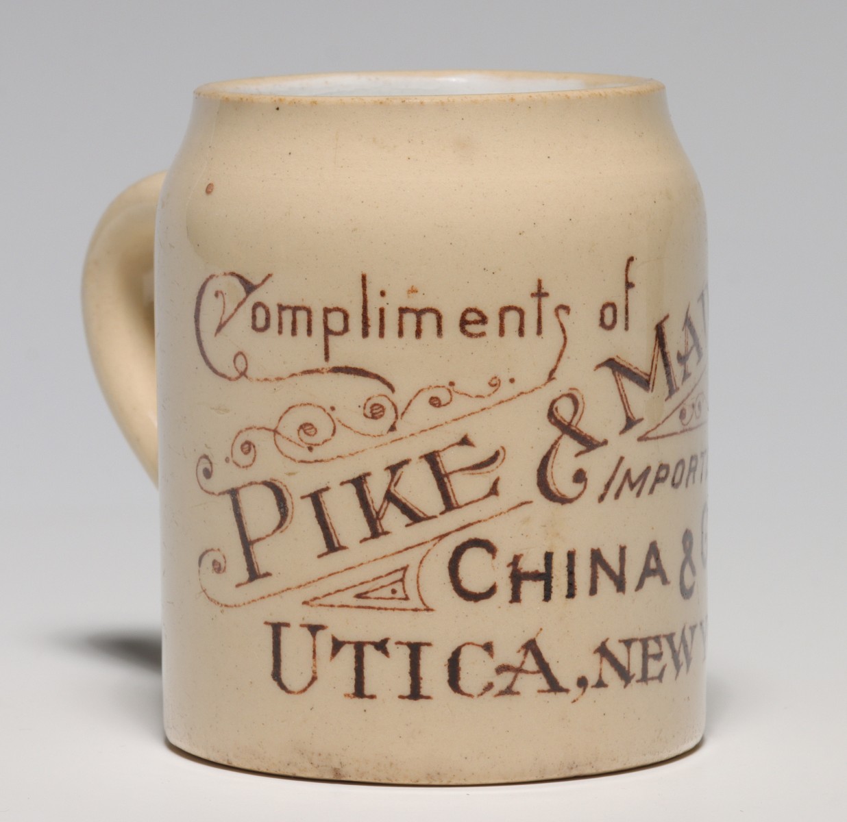 PIKE AND MADOC CHINA IMPORTERS STRIKER MUG C. 1900