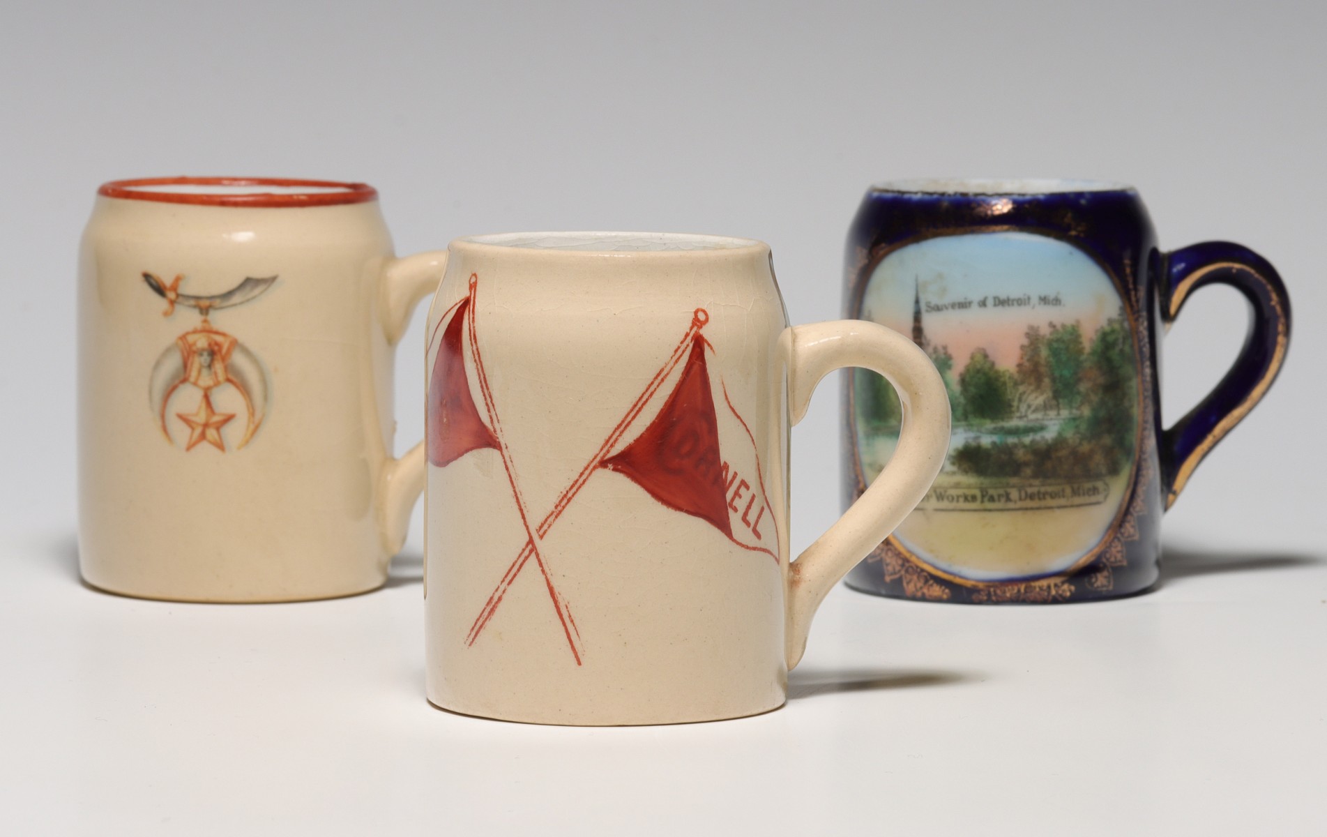 THREE CIRCA 1900 STRIKER MUGS