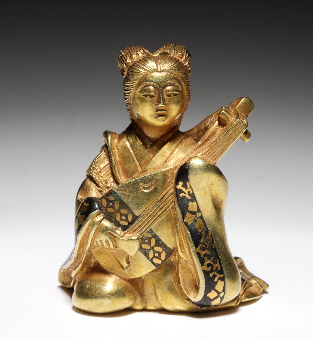 A MEIJI PERIOD HIGH KARAT GOLD OJIME MODEL OF BENTEN