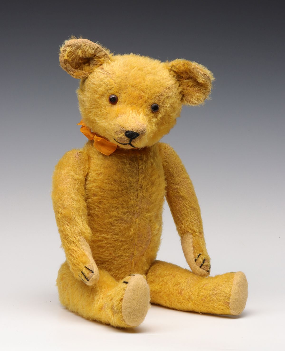 A GOOD 21-INCH GOLD MOHAIR TEDDY BEAR CIRCA 1900