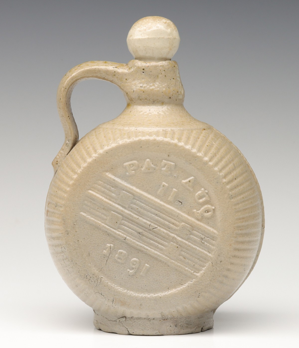 A SALT GLAZED STONEWARE DISC JUG PATENTED 1891