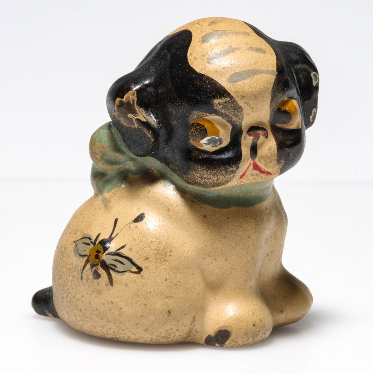 A HAND PAINTED FIGURAL PUP CAST IRON PAPERWEIGHT