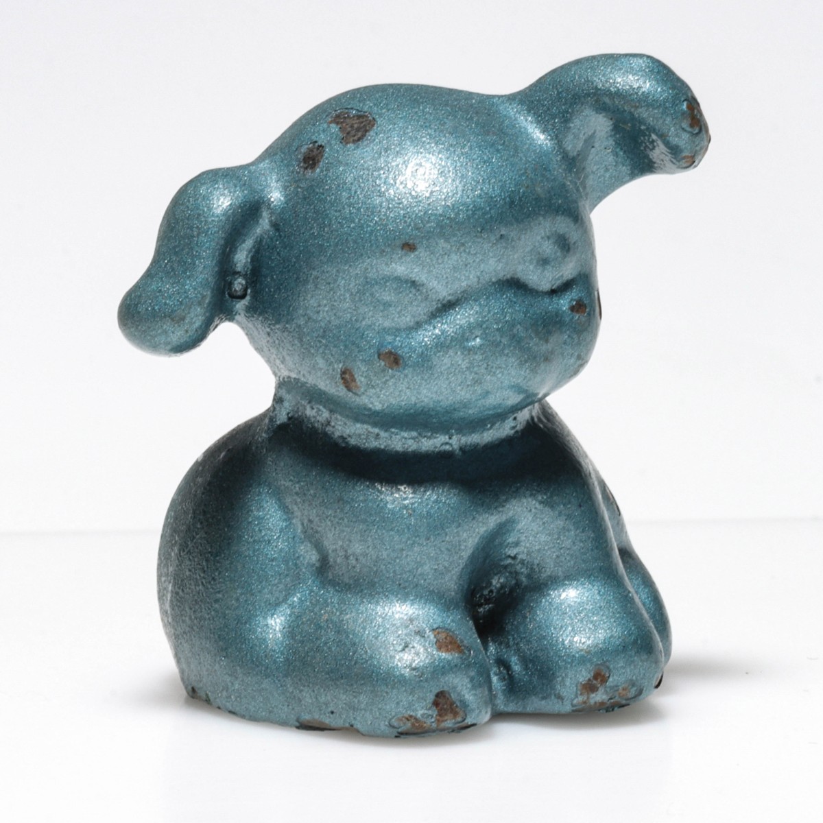 A BLUE PUP CAST IRON ADVERTISING PAPERWEIGHT