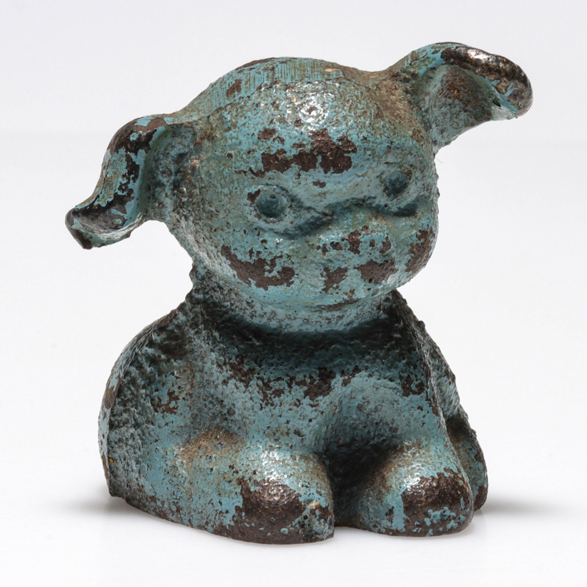 A FIGURAL PUP CAST IRON ADVERTISING PAPERWEIGHT