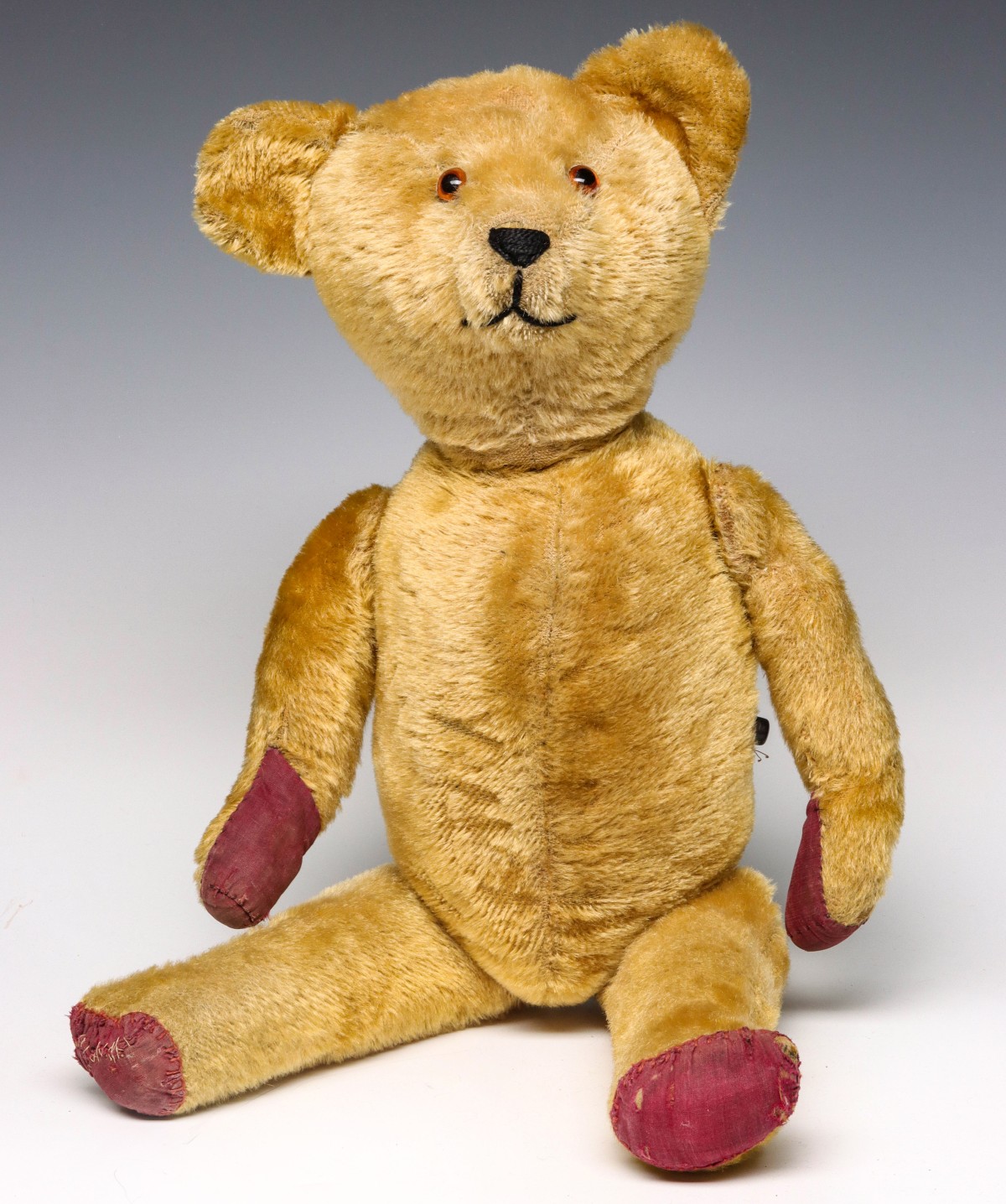 A LARGE ANTIQUE GOLD MOHAIR TEDDY BEAR W/GROWLER