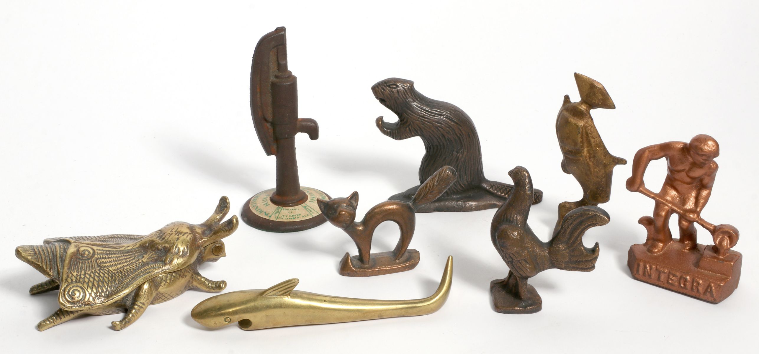 A COLLECTION OF EIGHT BRASS & IRON BOTTLE OPENERS