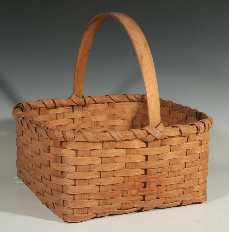 AN ANTIQUE SPLINT MARKET BASKET