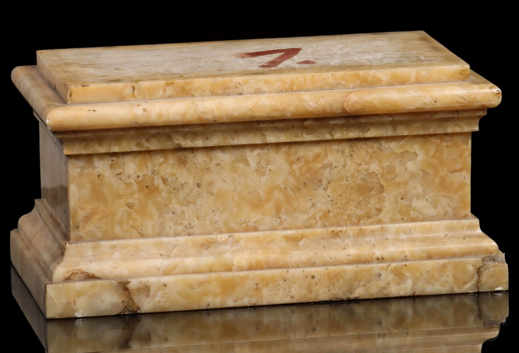 AN ANTIQUE CARVED MARBLE PLINTH