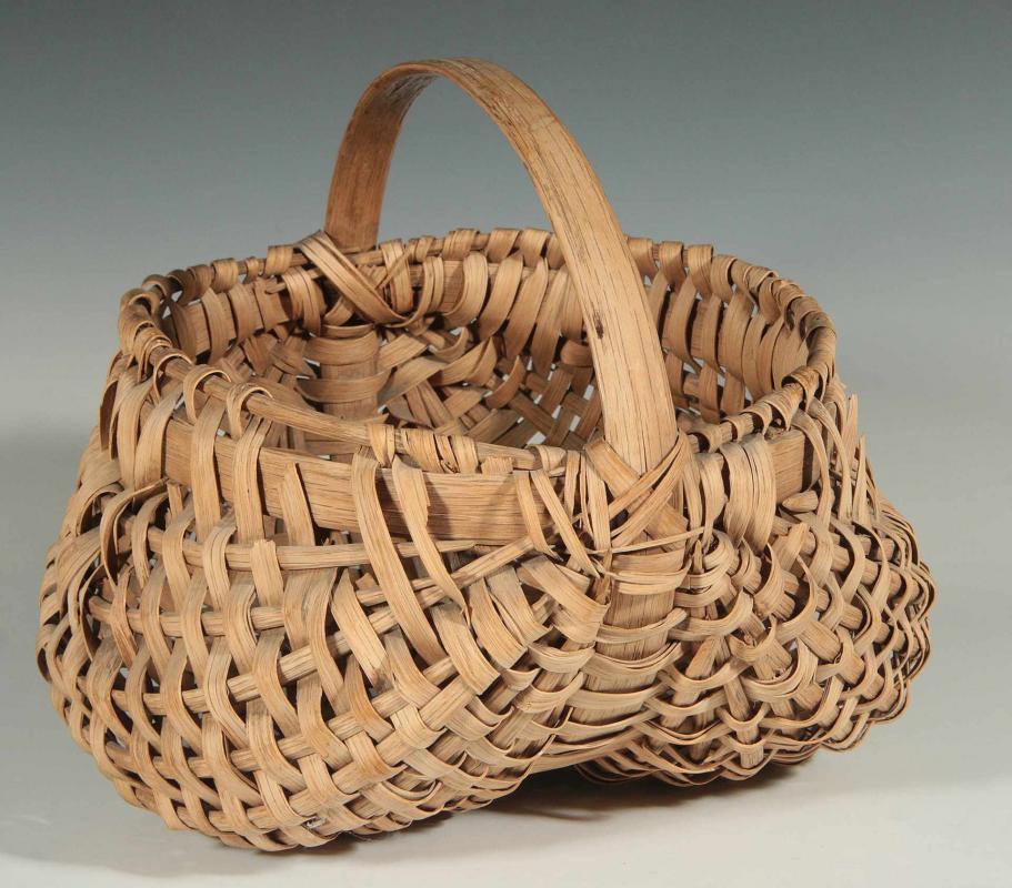 AN ANTIQUE BUTTOCKS BASKET