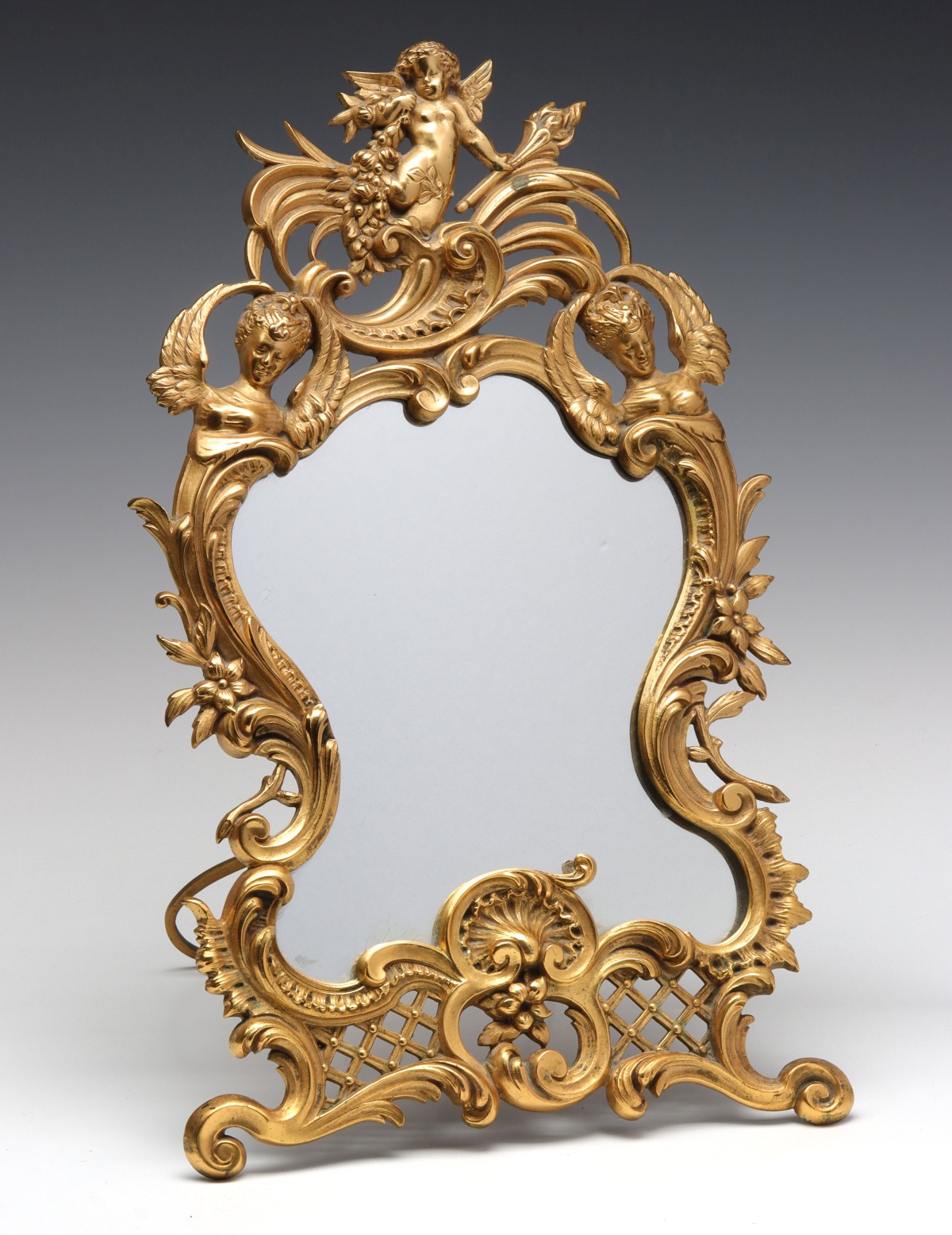 A FINE GILT BRASS MIRROR WITH CHERUB AND CARYATIDS