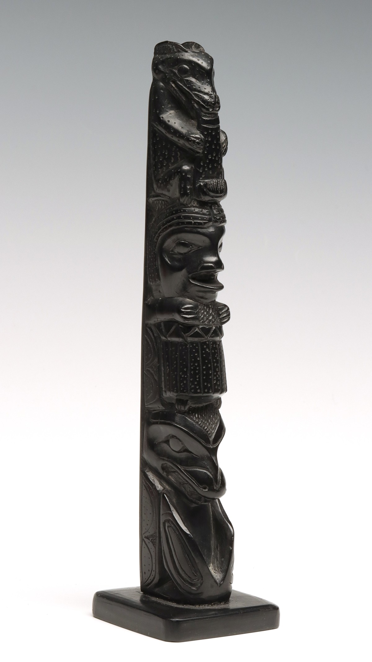 A 9-INCH NORTHWEST COAST ARGILLITE TOTEM POLE