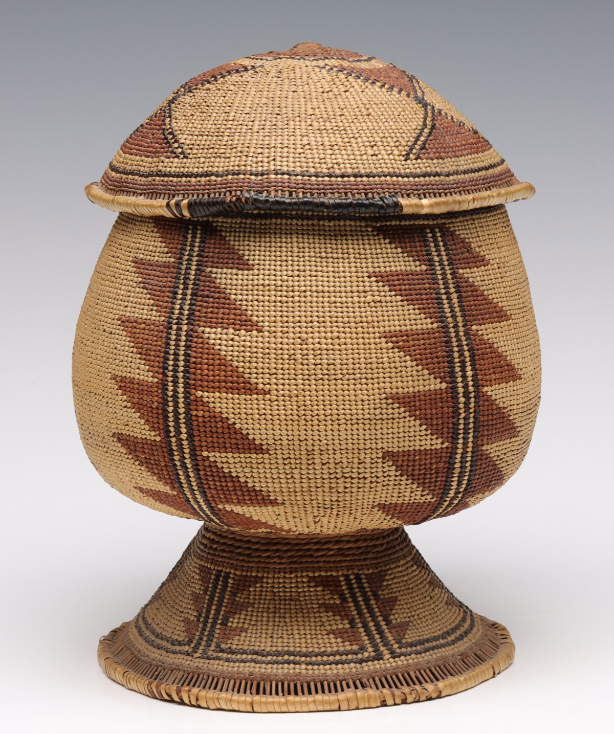 A HUPA OR KAROK PEDESTAL BASE TOBACCO BASKET WITH LID