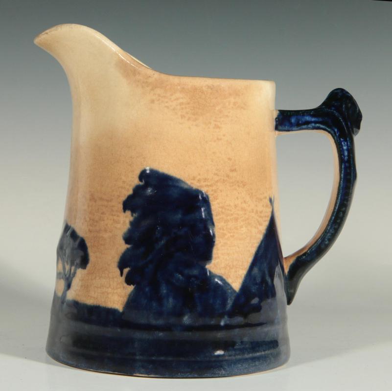 AN OLD SLEEPY EYE POTTERY PITCHER