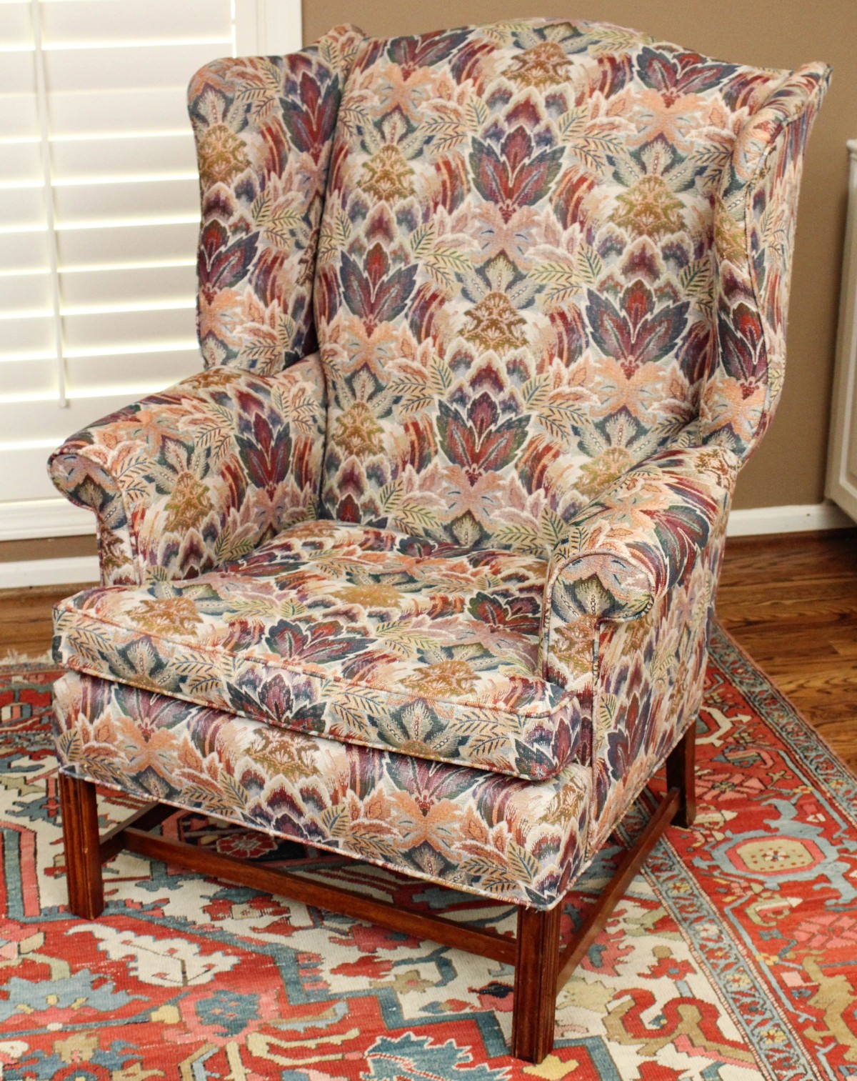 A GOOD CUSTOM UPHOLSTERED WINGBACK CHAIR