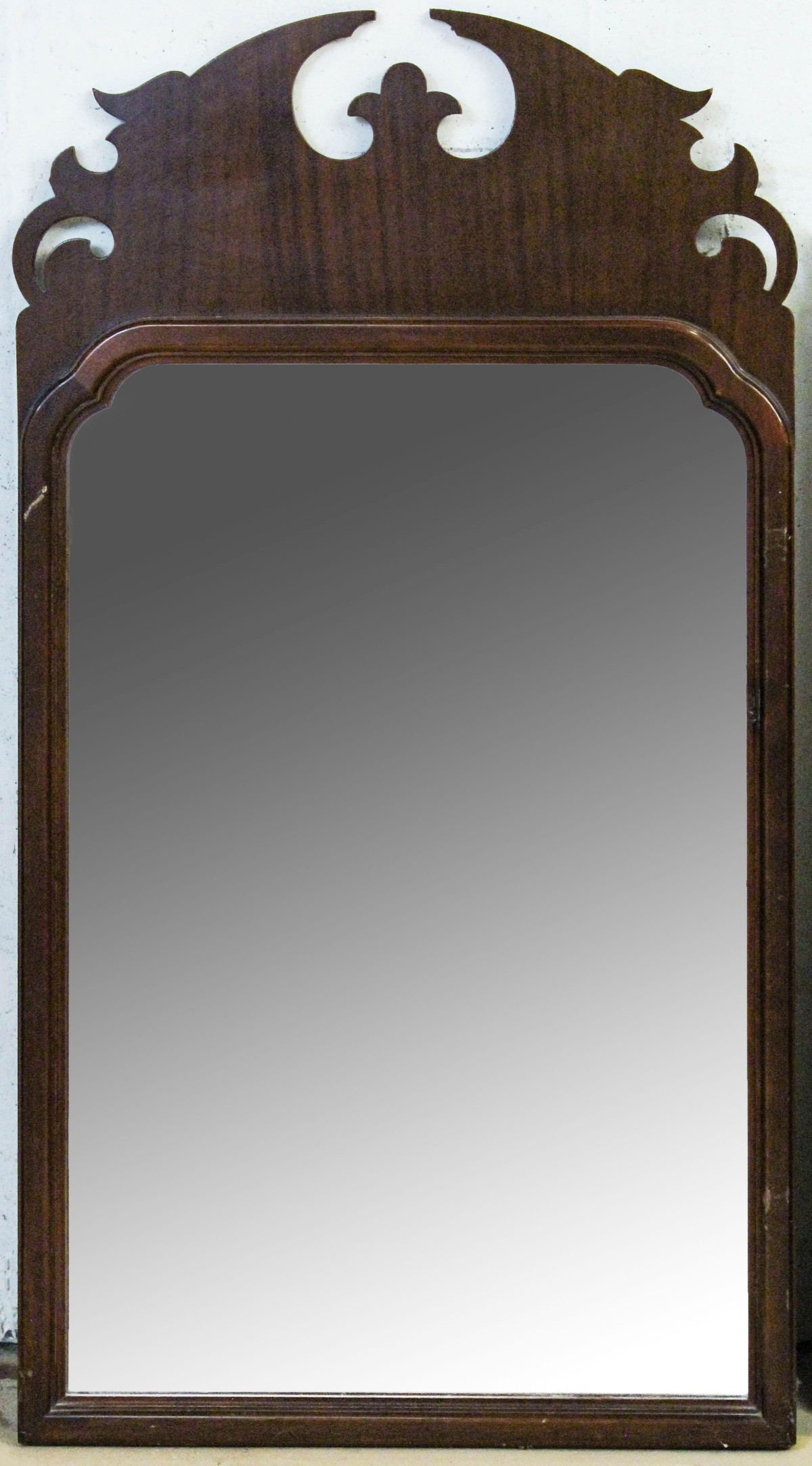 A 1920s SCROLL CUT CHIPPENDALE STYLE WALL MIRROR