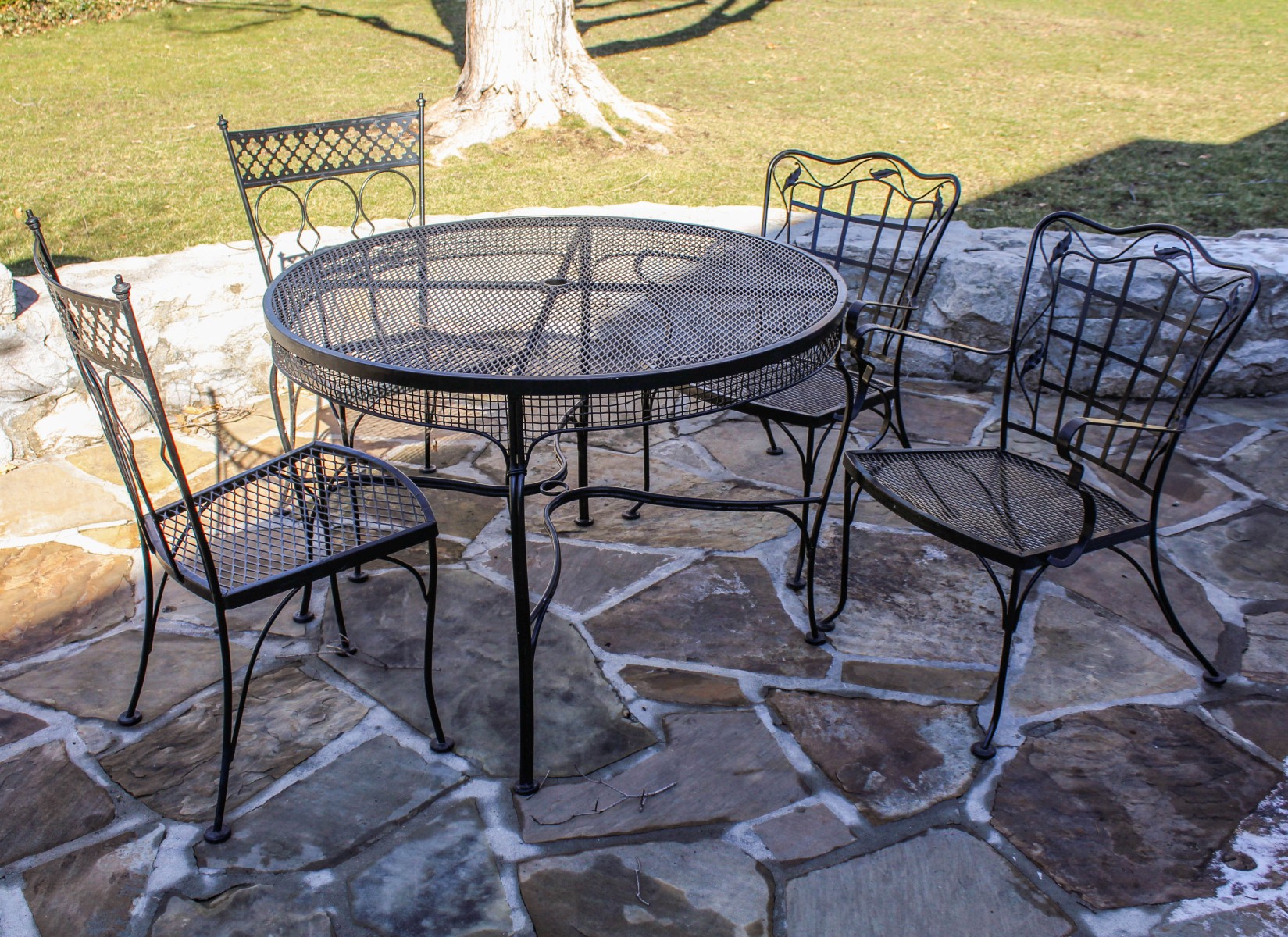 A NICE PATIO TABLE WITH TWO CHAIR PAIRS
